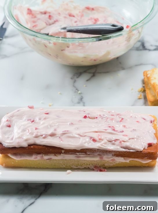 Frosting the Strawberries & Cream Layered Cake recipe for Easter