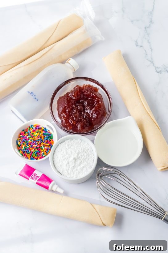 Key ingredients for making homemade Sheet Pan Strawberry Poptarts, including pie crusts and strawberry jam.