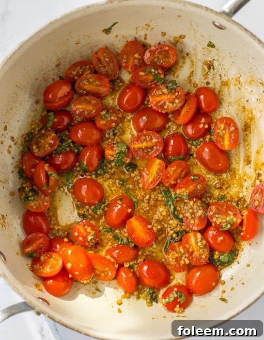 Roasting the tomatoes in the pan to make the Bruschetta Chicken Pasta recipe 
