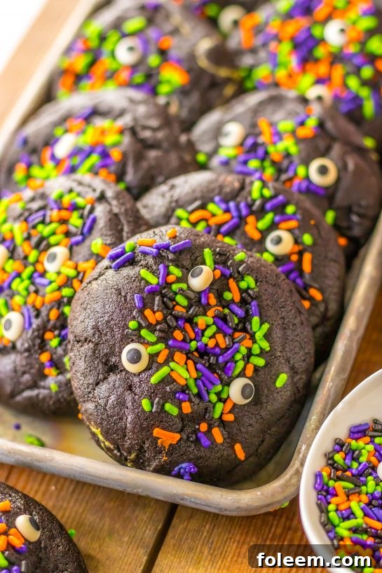 Easy Stuffed Black Velvet Cookies are perfect for Halloween dessert recipe. Dark chocolate cookies are stuffed with a creamy, green cheesecake filling that is so delicious. Halloween sprinkles top off these spooky cookies that kids and adults will love.