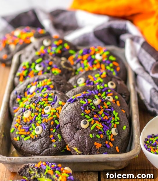 Easy Stuffed Black Velvet Cookies are perfect for Halloween dessert recipe. Dark chocolate cookies are stuffed with a creamy, green cheesecake filling that is so tasty. Halloween sprinkles top off these spooky cookies that kids and adults will love.