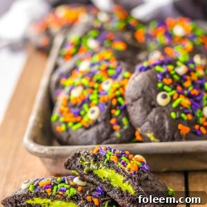 These Stuffed Black Velvet Cookies are perfect for a Halloween dessert recipe. Dark chocolate cookies are stuffed with a creamy cheesecake filling that is so delicious. Halloween sprinkles top off these spooky cookies that everyone will love at your party.