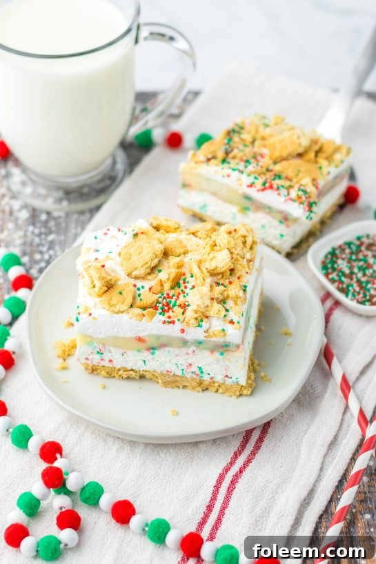 Christmas Cookie Lush recipe: a perfect, easy no-bake holiday dessert with vanilla cream cookies, cheesecake, pudding, whipped topping, and festive sprinkles.