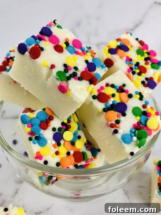 Sugar Cookie Fudge is a rich and creamy vanilla cookie dough fudge recipe. Made from eggless sugar cookie dough, this easy fudge tastes just like sugar cookies! This no bake fudge comes together quickly and will soon be your new favorite for Valentine's Day or any holiday!