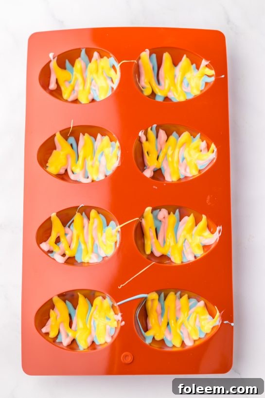 Pouring the ingredients into the egg molds to make the Easter Marshmallow Eggs recipe
