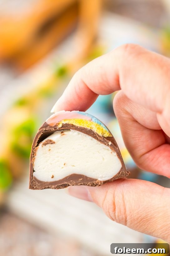 One of the completed Easter Marshmallow Eggs cut open to show the insides.