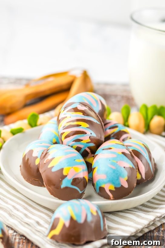 Simple Easter Marshmallow Eggs are the perfect no bake treat for Easter! They are adorable, delicious and a cinch to make! Chocolate Easter Eggs are filled with a fluffy, rich marshmallow filling. Perfect for your Easter dessert table or to fill Easter baskets with.