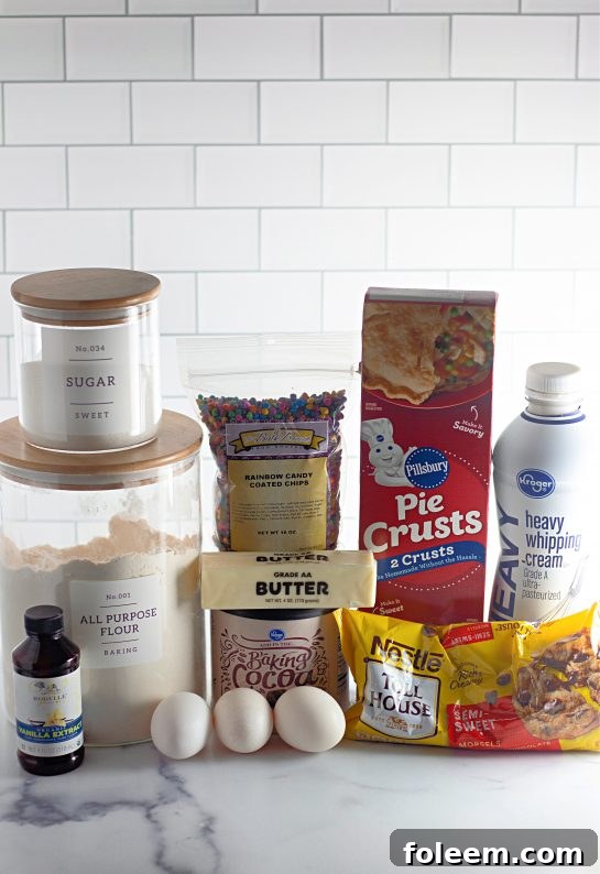 Essential ingredients for the Cosmic Brownie Pie laid out, featuring butter, eggs, sugar, cocoa powder, and chocolate chips.