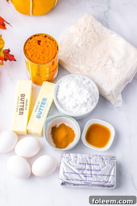 Ingredients for Pumpkin Gooey Butter Cake recipe on a wooden table