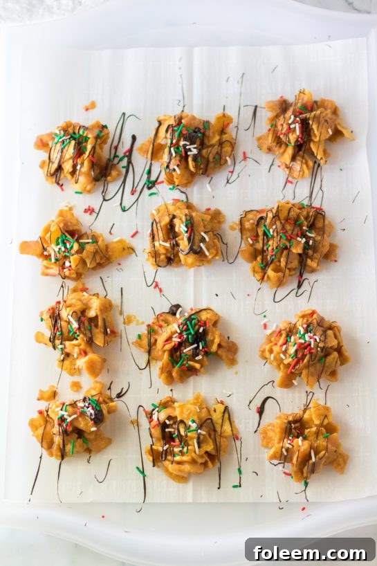 Overhead view of finished Frito Candy bites, beautifully drizzled with chocolate and decorated with festive sprinkles