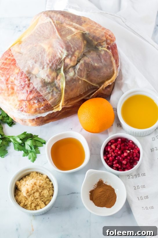 Ingredients laid out for a homemade Christmas ham glaze featuring orange juice, brown sugar, honey, and cinnamon.