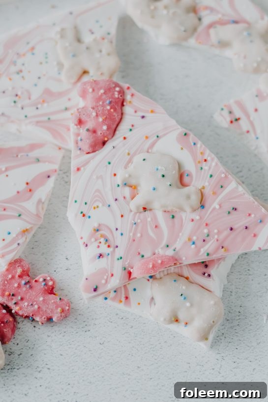 Vibrant No-Bake Circus Cookie Bark featuring circus animal cookies, white chocolate, and rainbow sprinkles, perfect for parties and celebrations.