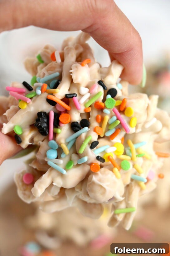 Festive White Chocolate Halloween Crock Pot Candy, a no-bake treat with chow mein noodles, white chocolate, and sprinkles, loved by all ages.