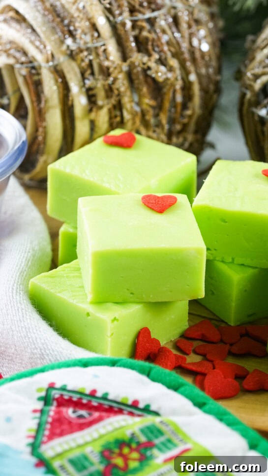 This Grinch Fudge recipe combines white chocolate, sweetened condensed milk, and green food coloring to create a creamy, no-bake Christmas fudge. Perfect for holiday parties, kids’ treats, cookie exchanges, and festive dessert trays!