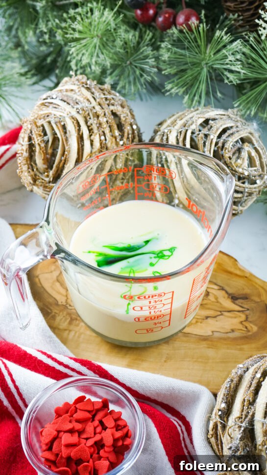 Mixing the food coloring and sweetened condensed milk together to make green