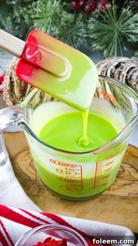 Green food coloring ready to be made into Grinch Fudge recipe
