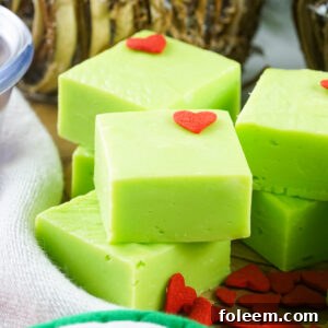 This Grinch Fudge recipe combines white chocolate, sweetened condensed milk, and green food coloring to create a creamy, no-bake Christmas fudge. Perfect for holiday parties, kids’ treats, cookie exchanges, and festive dessert trays!