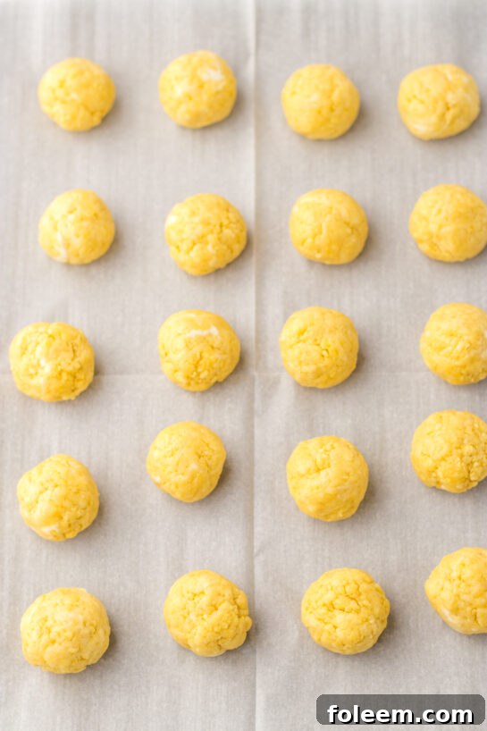 Forming the cake balls for the Bunny Butt Lemon Truffles recipe, ready for chilling.