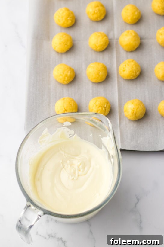 White chocolate coating for Bunny Butt Lemon Truffles melting smoothly, ready for dipping.