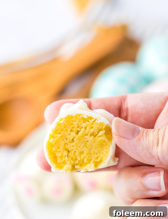 A sliced Bunny Butt Lemon Truffle revealing its creamy lemon Oreo filling.