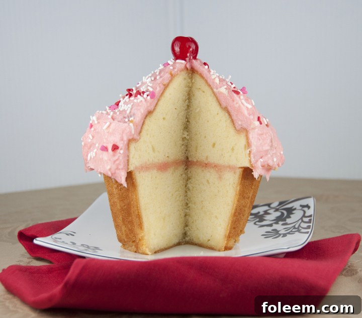 A giant cupcake, fully assembled and decorated, showcasing its impressive size.