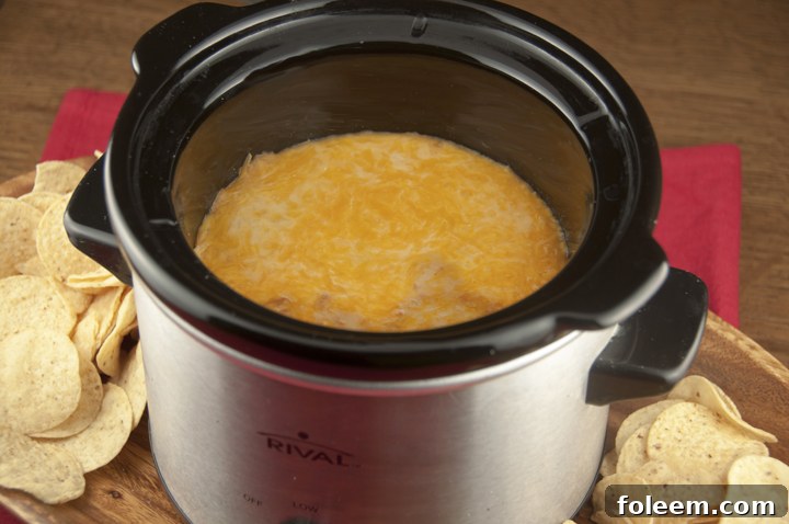 Crock Pot Cheesy Bean Dip Appetizer Recipe (Slow Cooker) for football food, game day, Super Bowl.