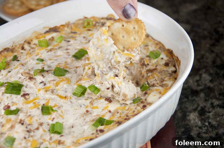 Creamy Bacon and Cheese Dip loaded with bacon is the perfect, cheesy appetizer recipe for any party, game day or an easy super bowl party appetizer!