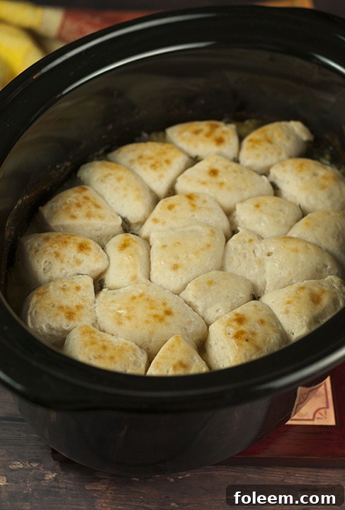 Creamy, comforting chicken and dumplings dinner recipe made in the crock pot that couldn't be easier to make. Just throw everything in your slow cooker and done!