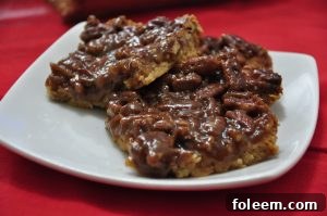 Detailed view of the layered Pecan Pie Bars with golden crust and nutty topping