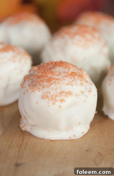 Sweet and adorable cream cheese and crushed Pumpkin Spice Oreo cookie balls are the perfect dessert for Halloween.