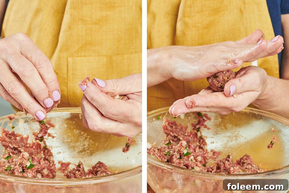 Woman rolling meatballs by hand.