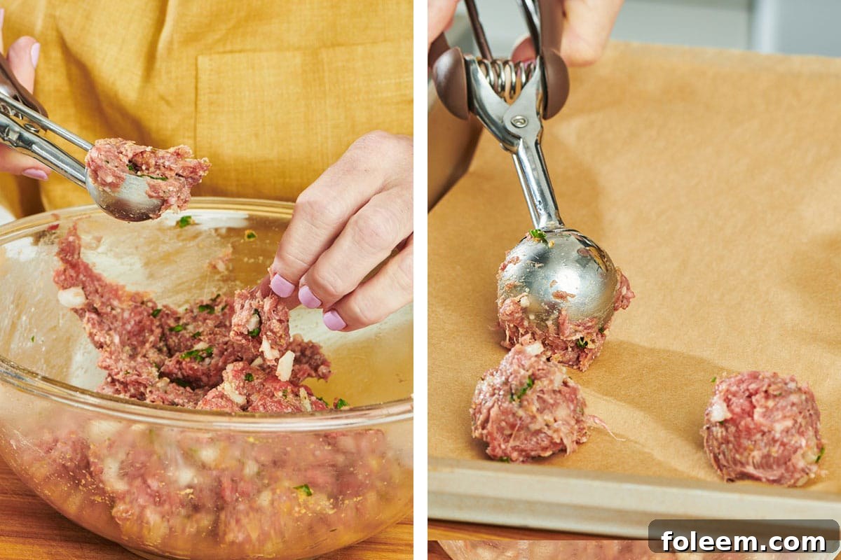 Woman scooping meatball mixture with ice cream scoop.