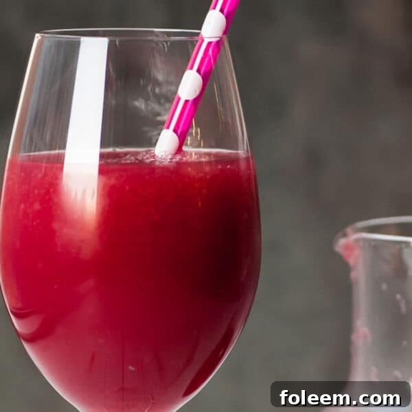Frozen pomegranate cocktail in glass.