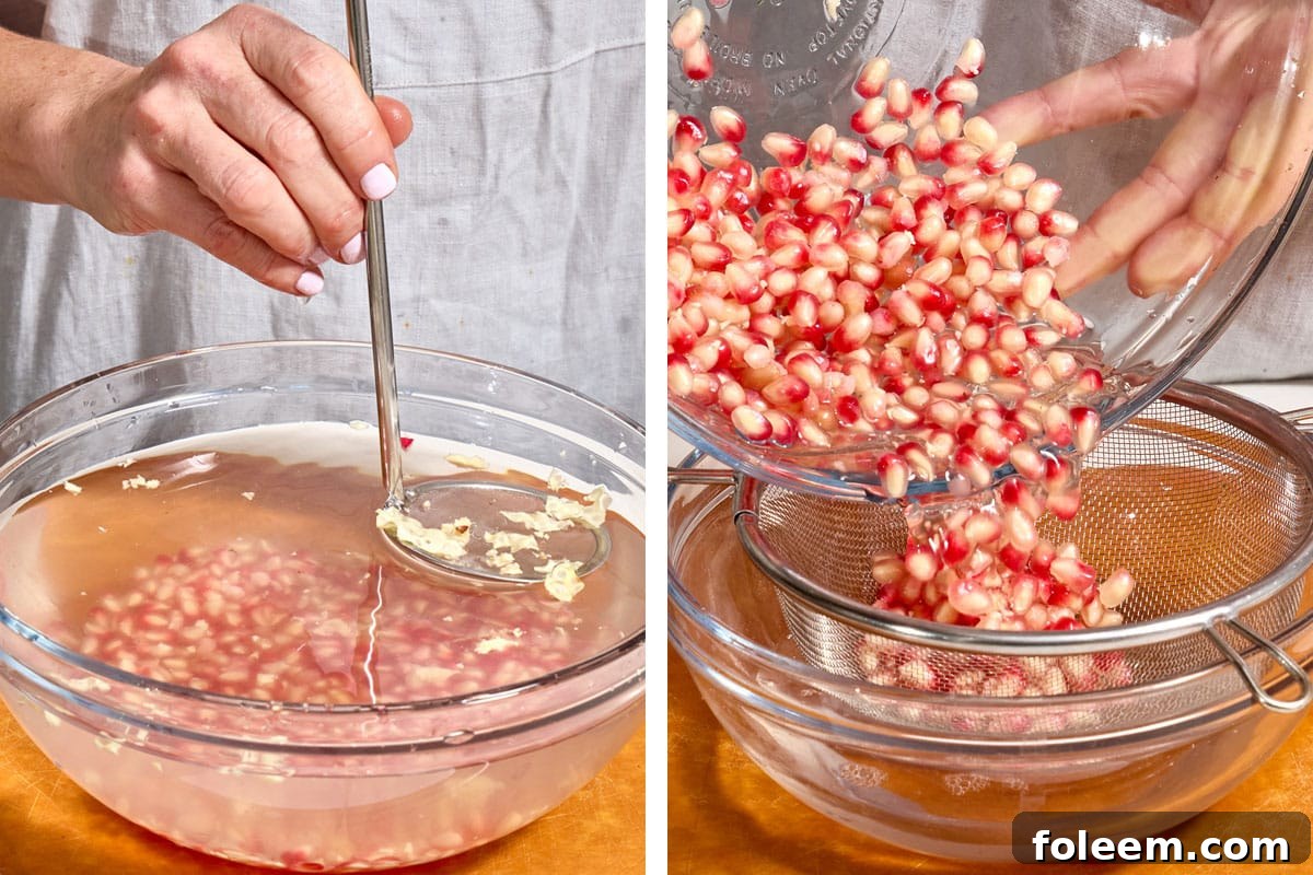 Straining fresh pomegranate arils from water.