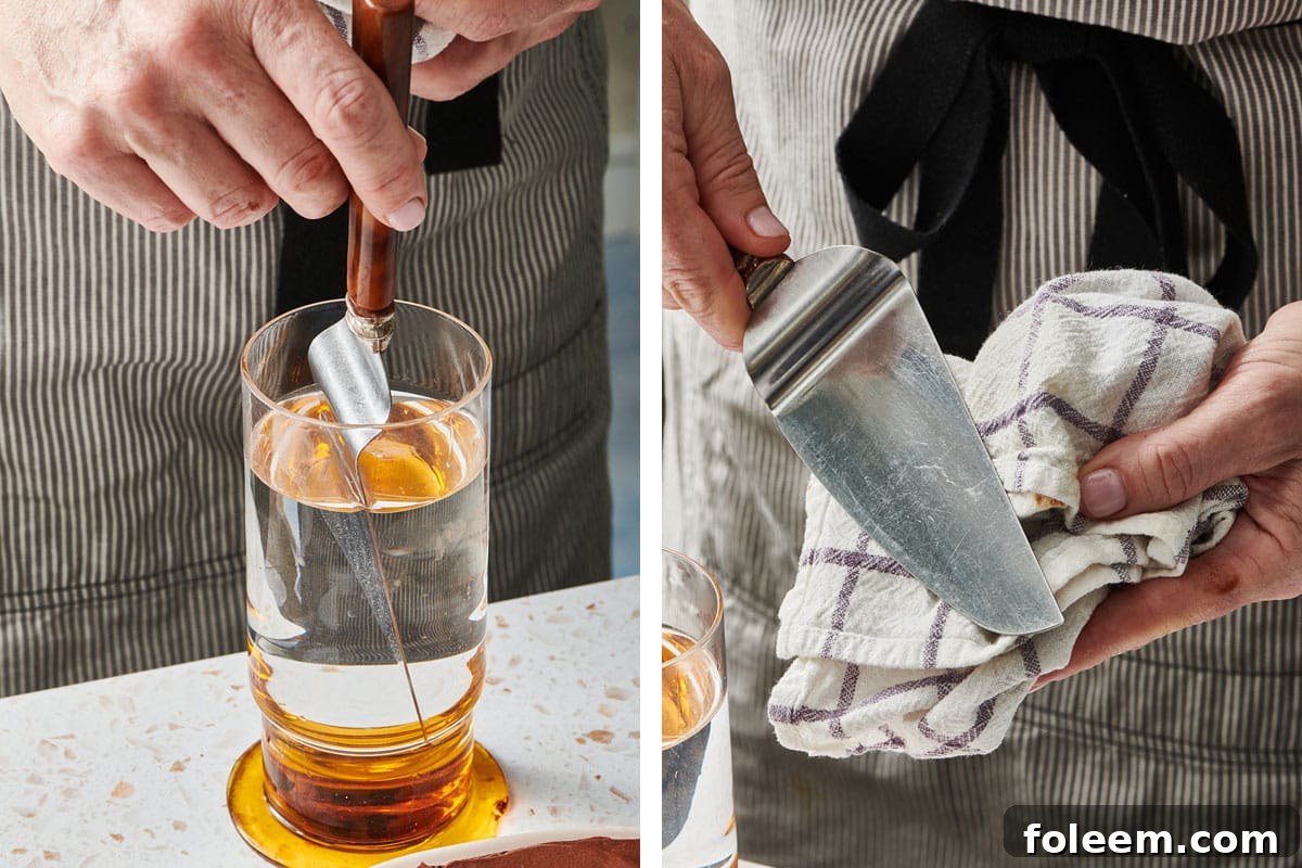 Woman dipping cake knife into water and wiping with towel.