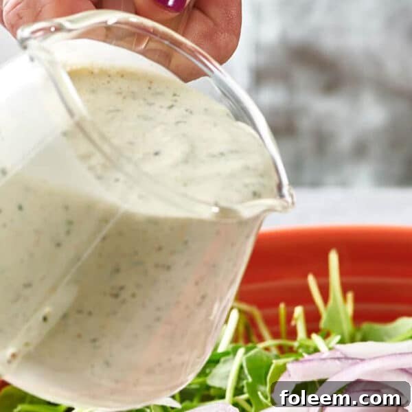 Homemade ranch dressing in small pitcher.