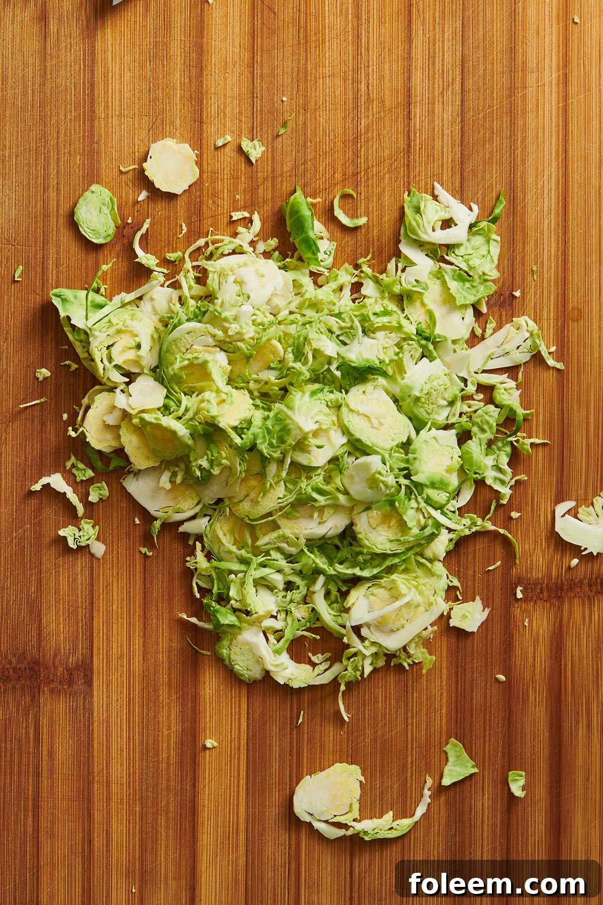 Shredded Brussel sprouts on cutting board.