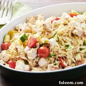 Black bowl of Greek Chicken Pasta Salad.
