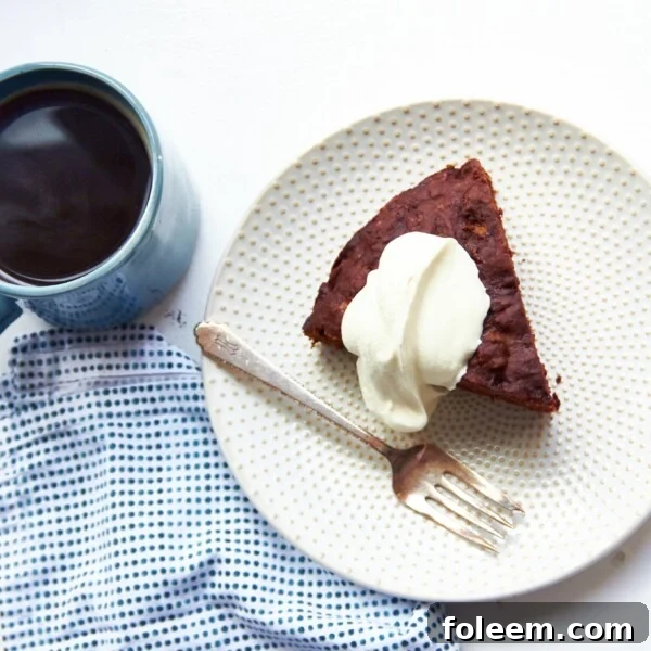 Fork and a slice of Chocolate Banana Cake on a plate.