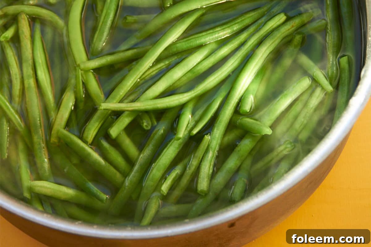 Blanching green beans in large pot of water.