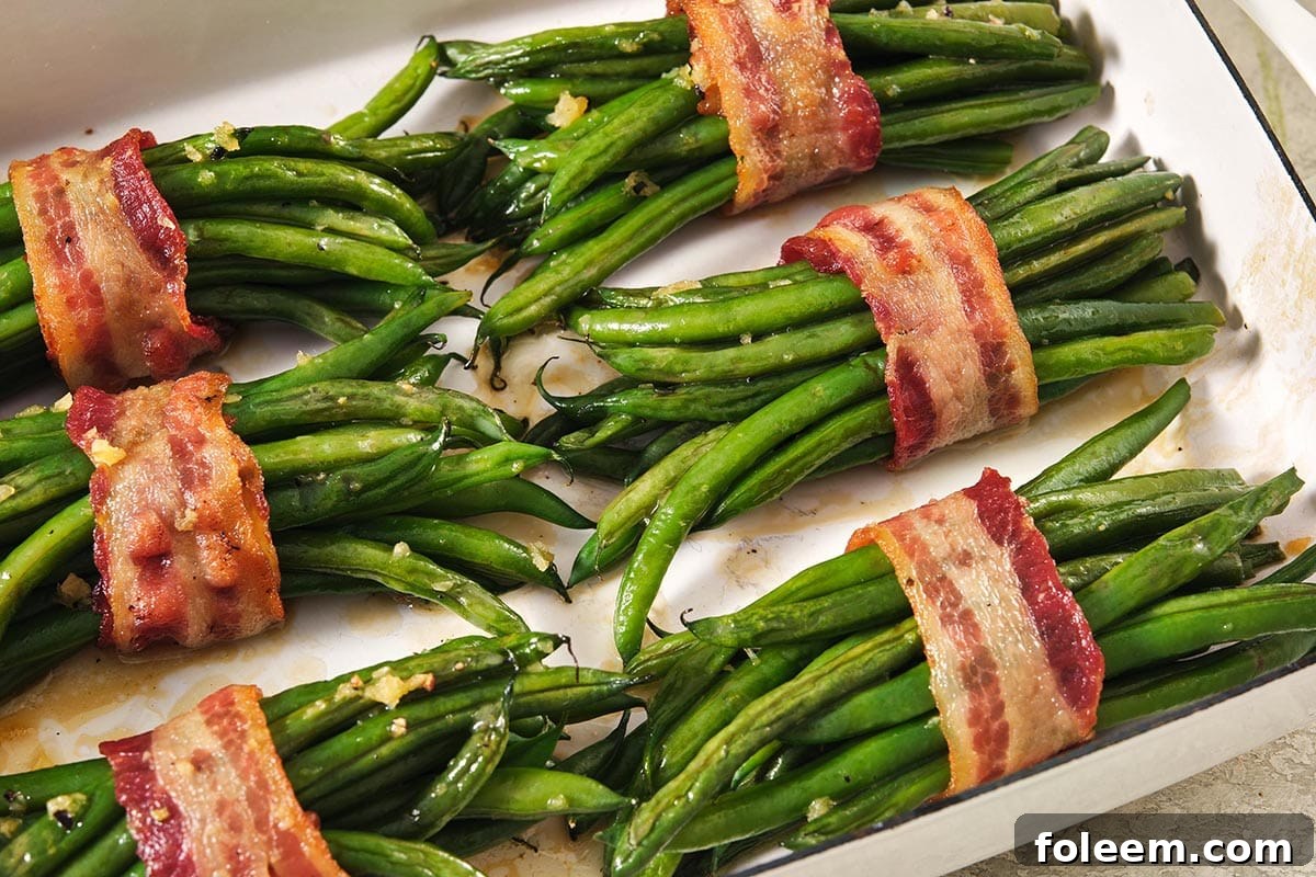 Bacon wrapped around groups of green beans.