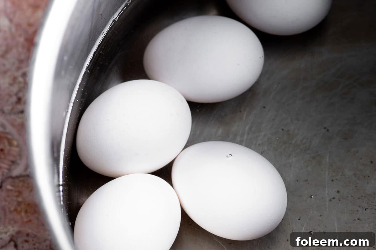 Eggs in a pot of water.