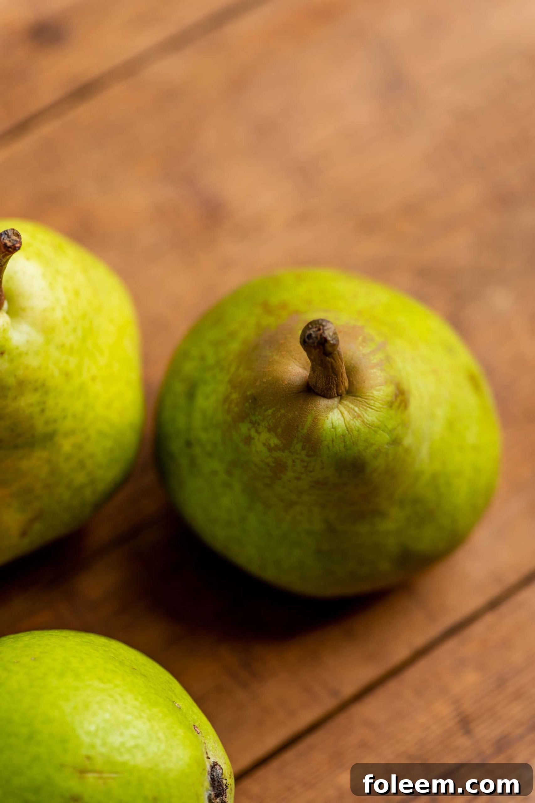 Pears on a wooden surafce.