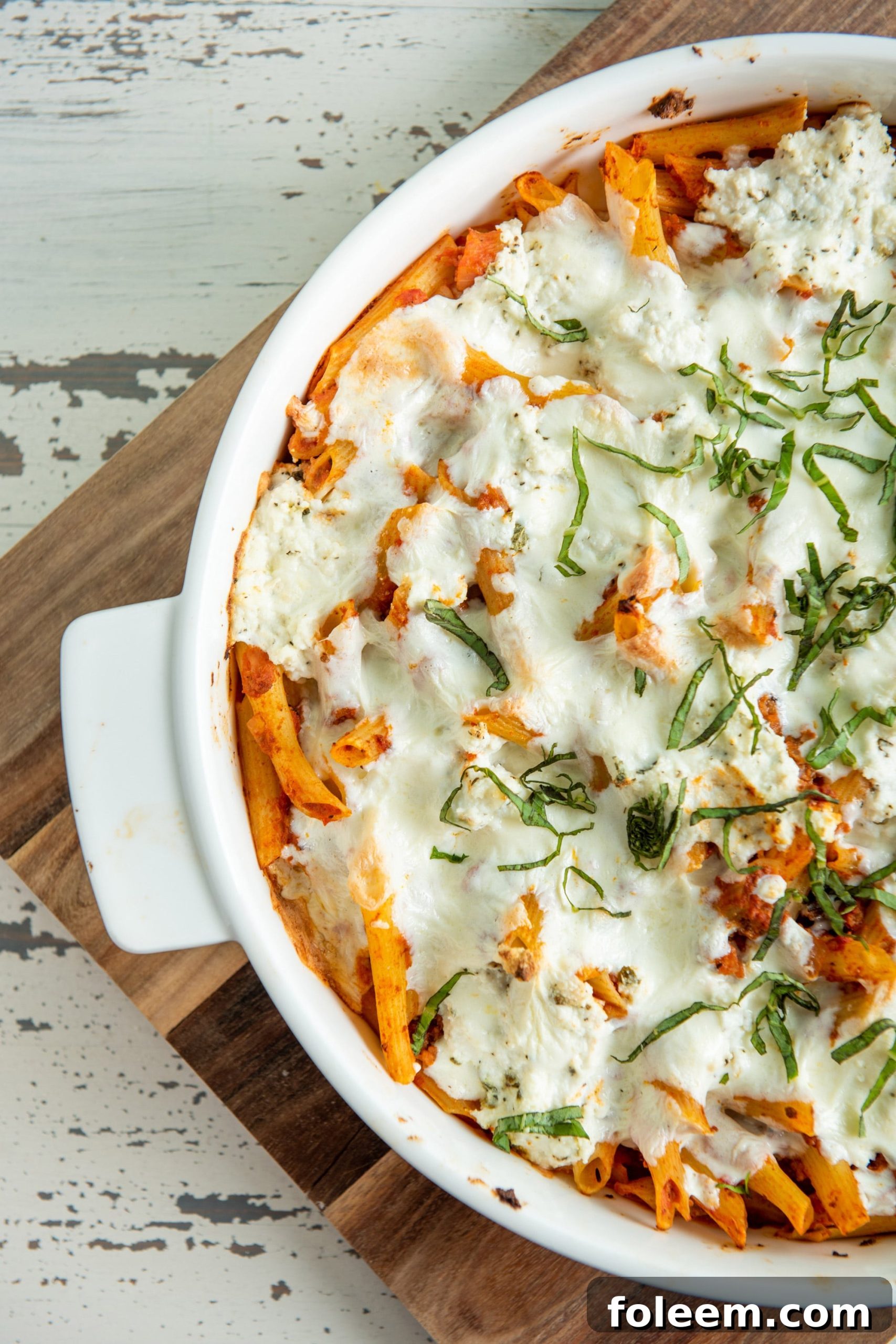 White dish of Baked Pasta with Bolognese Sauce.