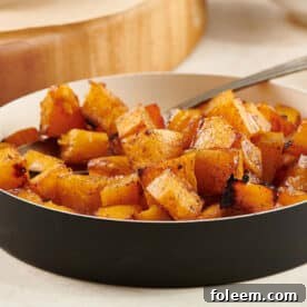 Maple Roasted Butternut Squash in dish on table.