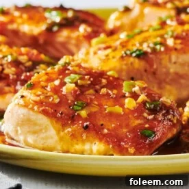 Ginger and lemongrass salmon filets on yellow plate.