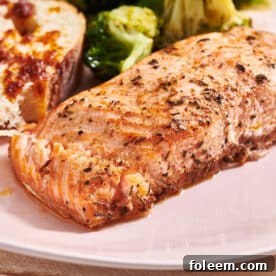 Herbed salmon filet on pink plate