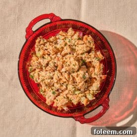 Canned salmon salad in red glass bowl