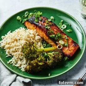 Miso Salmon on a plate with broccoli and rice.