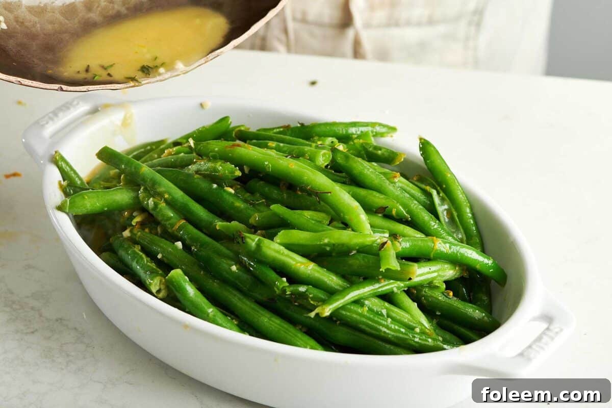 Green Beans with Gremolata in white serving dish.